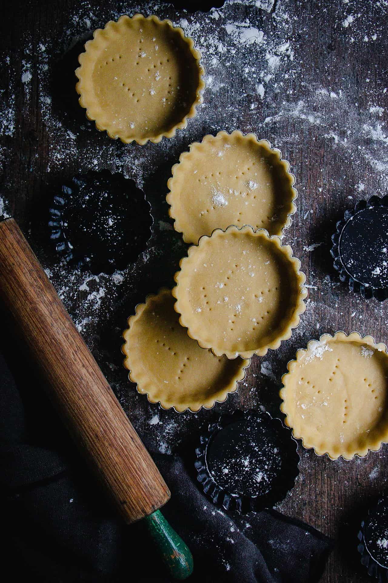 sour cream pastry mini tarts, docked and ready to be blind baked