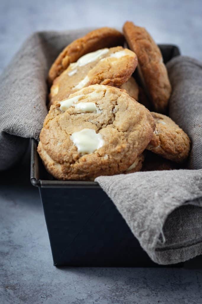 maple white chocolate cookies on a linen tea towel in a loaf pan 