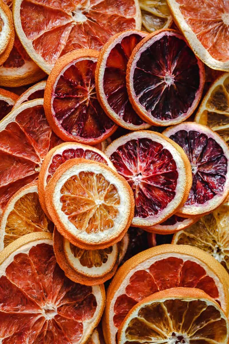 An abundance of dehydrated citrus slices (dried oranges, grapefruit, lemons).