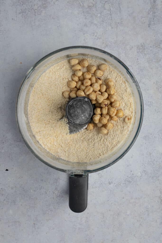 Add toasted hazelnuts to the food processor and pulse til roughly chopped