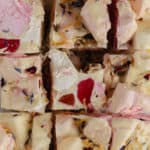 A slab of white chocolate rocky road cut into squares.