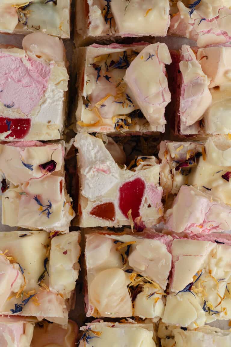 A slab of white chocolate rocky road cut into squares.
